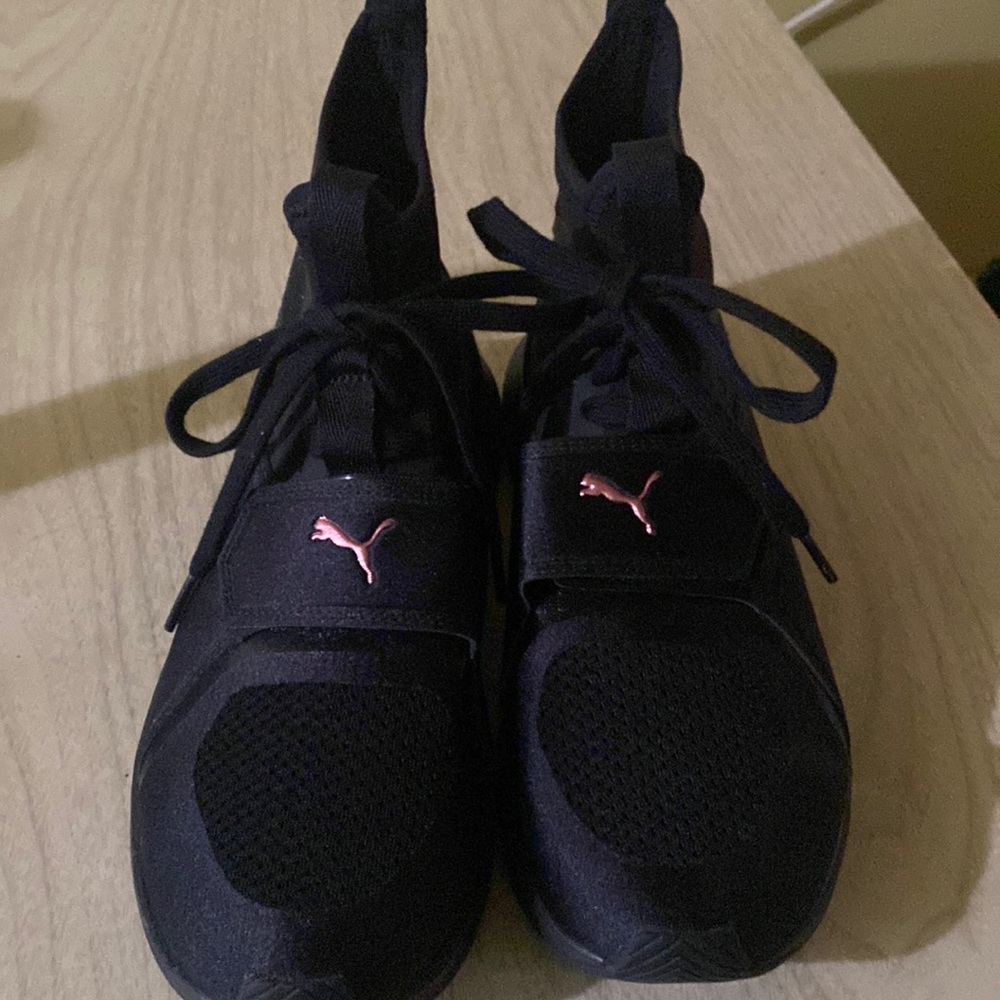 Sleek black pair of Puma  Ignite athletic shoes